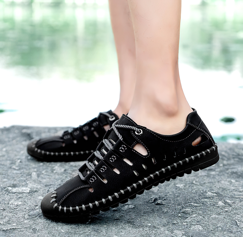 Men's black lace-up leather sandals for outdoor activities, featuring a breathable design and durable rubber outsole, ideal for water exploration.